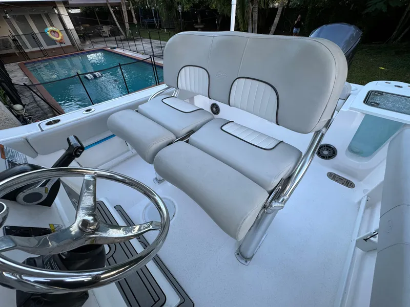 Slide: The Image of 2022 Sea Fox 248 Commander boat helm seating and steering wheel. - 26