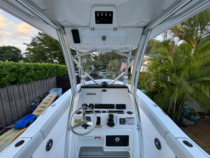 Slide: The Image of 2022 Sea Fox 248 Commander boat cockpit with steering wheel and control panel. - 27