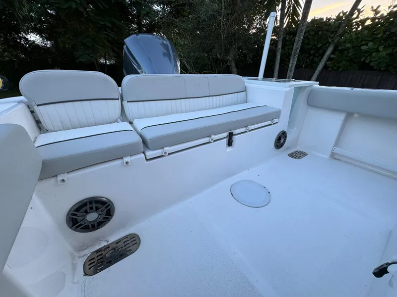 Slide: The Image of 2022 Sea Fox 248 Commander boat interior with cushioned seating and built-in speakers. - 29