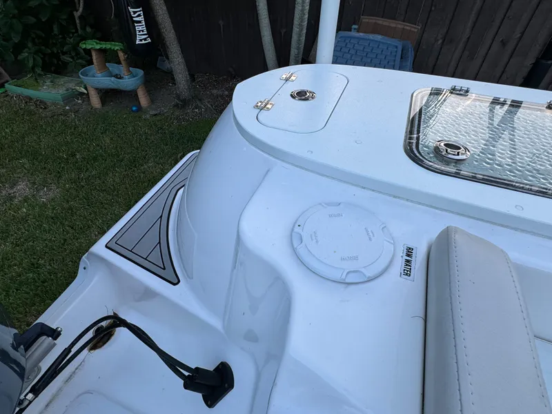 Slide: The Image of 2022 Sea Fox 248 Commander boat deck with storage compartments and seating. - 36