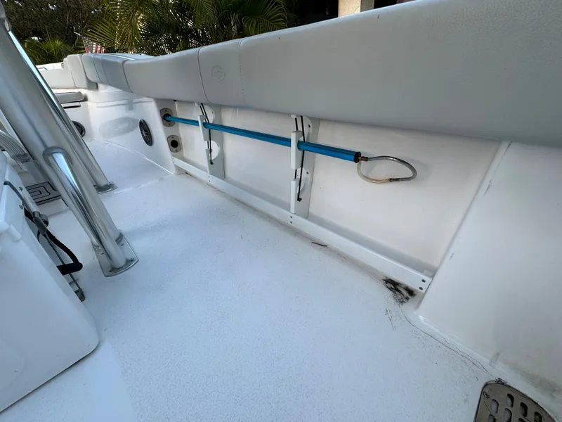 Slide: The Image of 2022 Sea Fox 248 Commander boat interior with rod holders and cushioned seating. - 39
