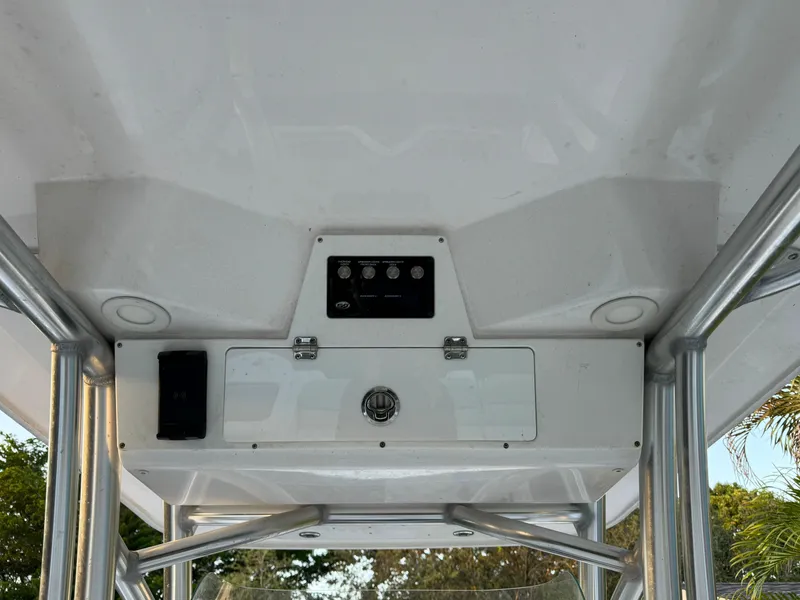 Slide: The Image of 2022 Sea Fox 248 Commander boat console with control panel and storage compartment. - 42