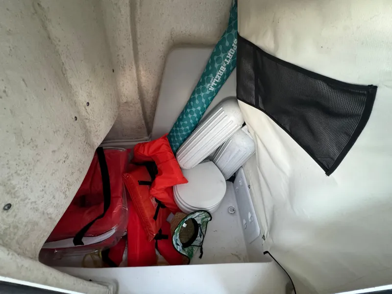 Slide: The Image of Storage compartment of a 2022 Sea Fox 248 Commander boat with life jackets and accessories. - 43