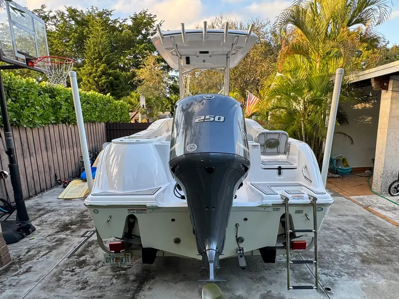 Slide: The Image of 2022 Sea Fox 248 Commander boat with 250 HP engine, parked in a driveway. - 7