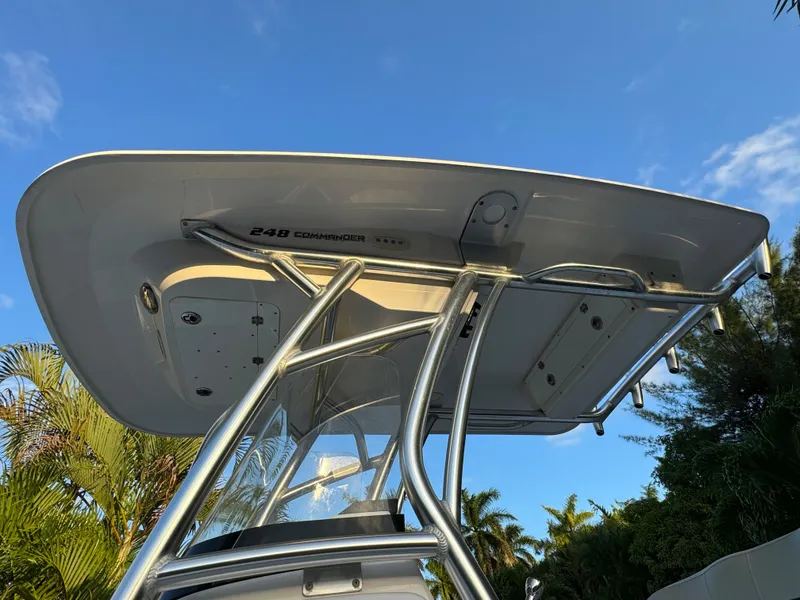 Slide: The Image of 2022 Sea Fox 248 Commander boat T-top against blue sky. - 8