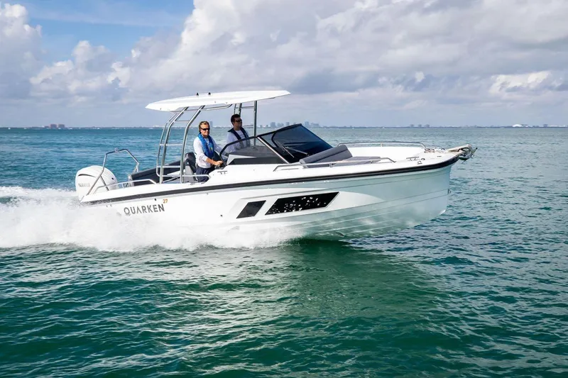 The Image of 2024 Quarken 27 T-Top V2 boat cruising on open water. - 1
