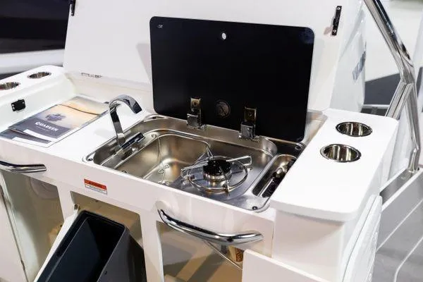 Slide: The Image of 2024 Quarken 27 T-Top V2 boat kitchen sink and stove area. - 14