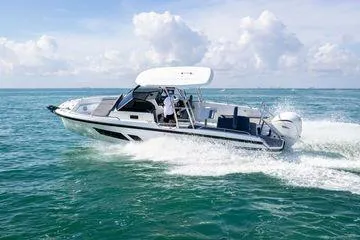 Slide: The Image of 2024 Quarken 27 T-Top V2 boat cruising on open water. - 4