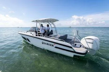 Slide: The Image of 2024 Quarken 27 T-Top V2 boat cruising on clear blue water. - 5