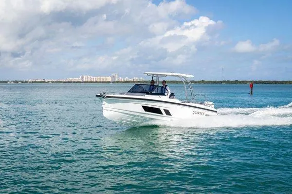 Slide: The Image of 2024 Quarken 27 T-Top V2 boat cruising on a sunny day. - 7