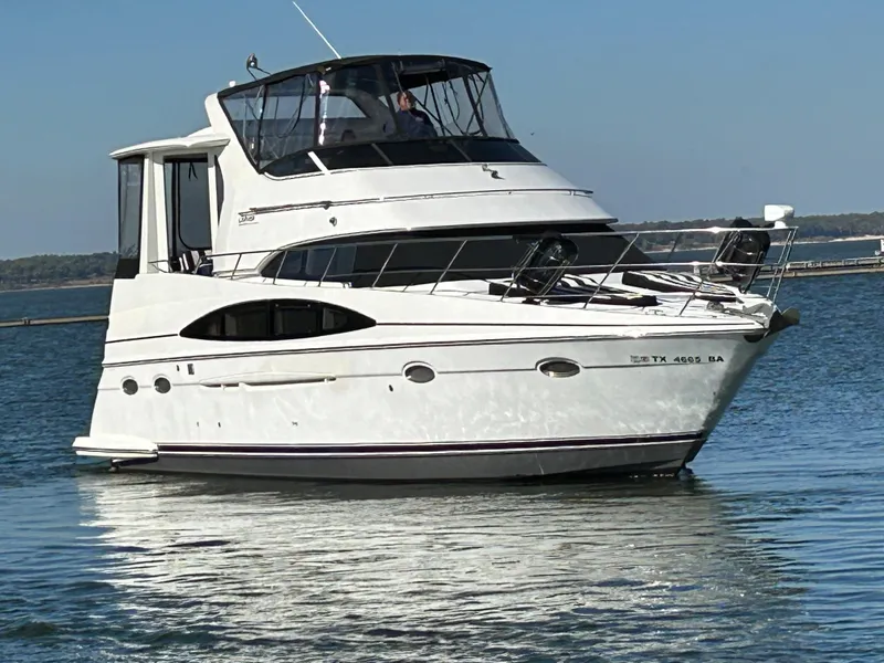 Slide: The Image of 2000 Carver 396 yacht cruising on a calm lake. - 1