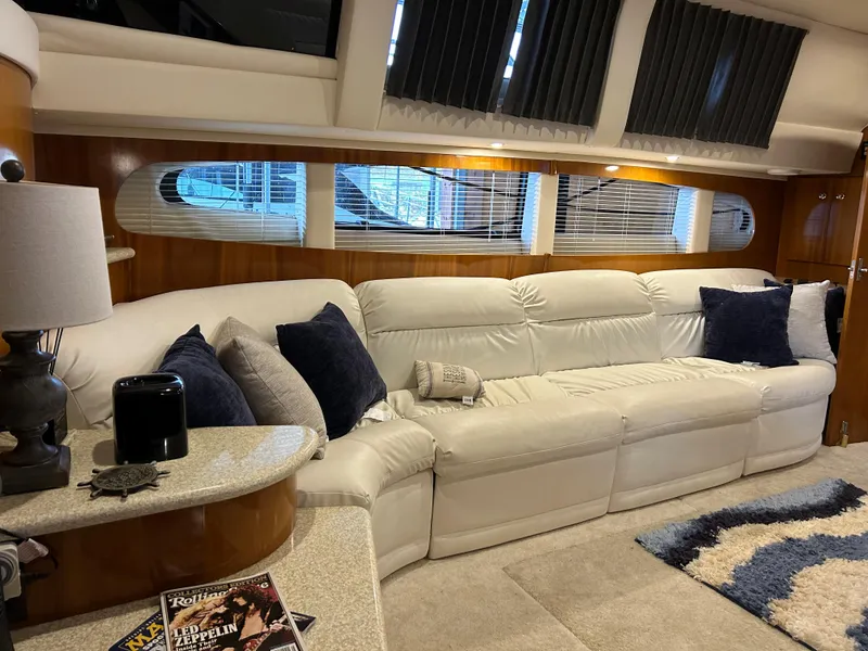 Slide: The Image of Luxurious interior of a 2000 Carver 396 yacht with plush seating and elegant decor. - 25