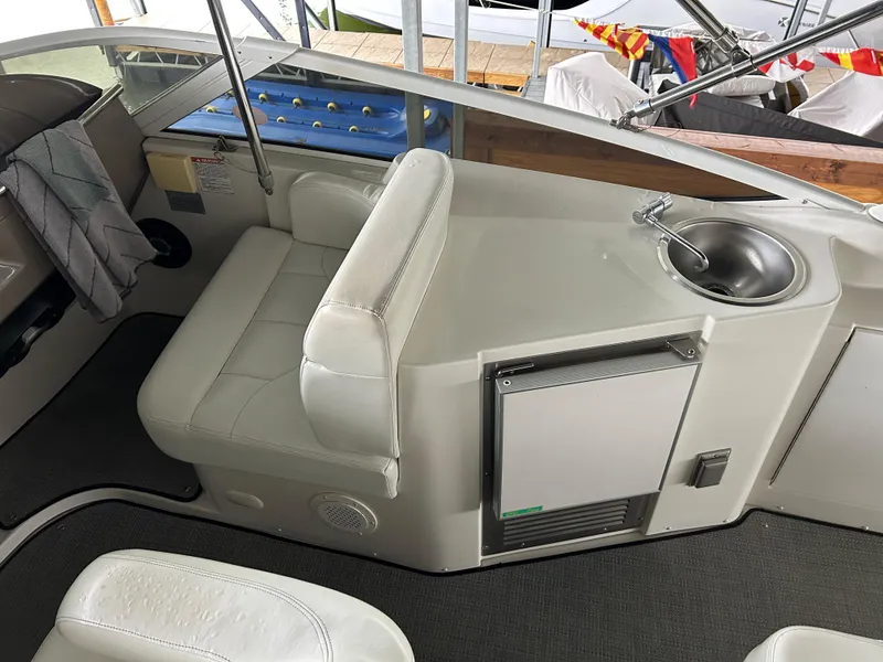 Slide: The Image of Interior of a 2000 Carver 396 yacht with seating and a small sink. - 35