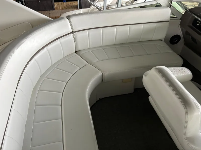 Slide: The Image of White leather seating on a 2000 Carver 396 boat interior. - 37