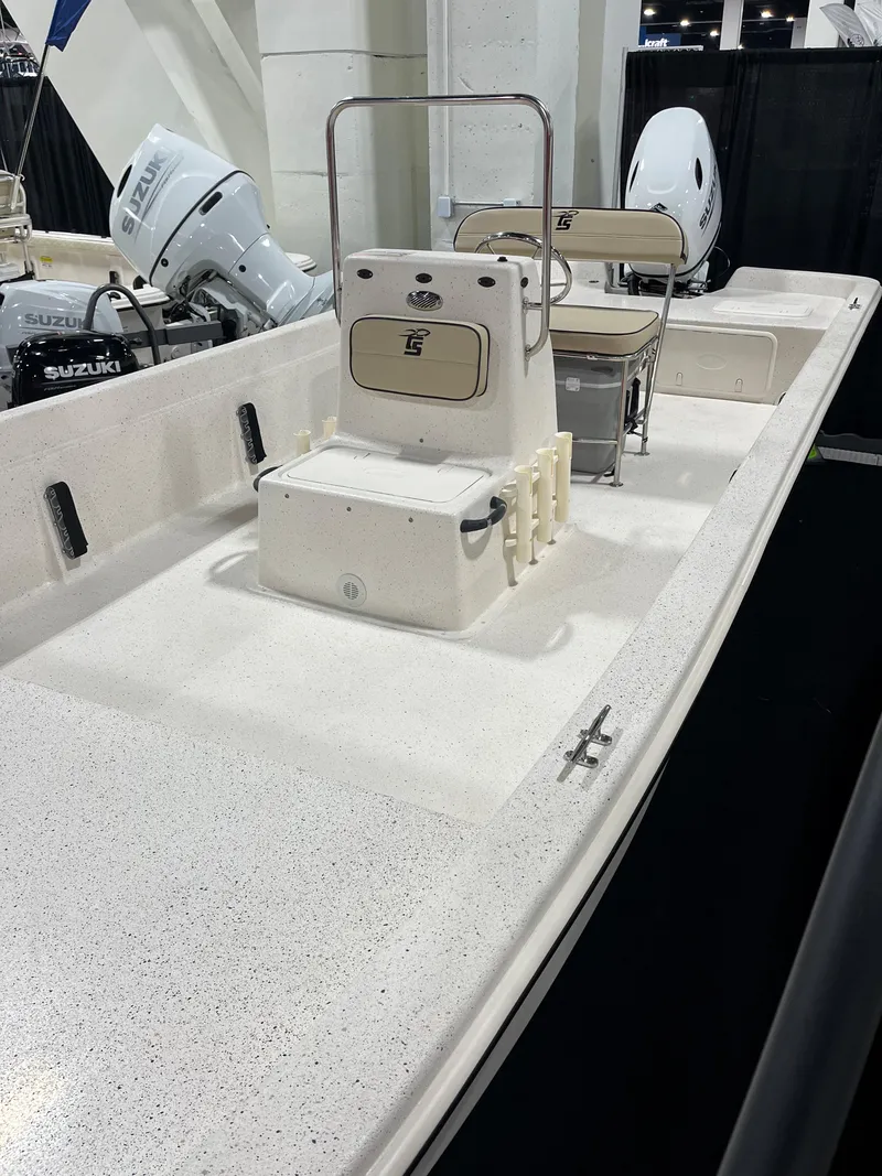 Slide: The Image of 2024 Carolina Skiff e21 DLX boat interior with center console and seating. - 14