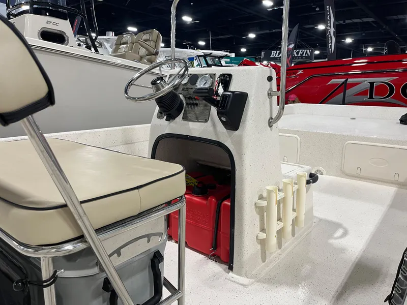 Slide: The Image of 2024 Carolina Skiff e21 DLX boat interior with steering console and seating. - 5