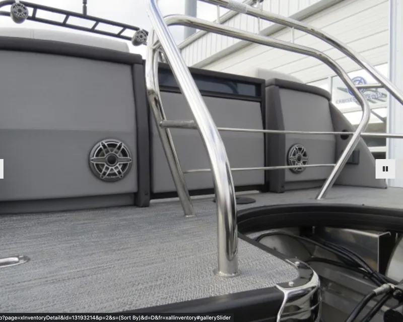 Slide: The Image of 2023 Godfrey AquaPatio 255 SBC boat deck with stainless steel railings and speakers. - 3
