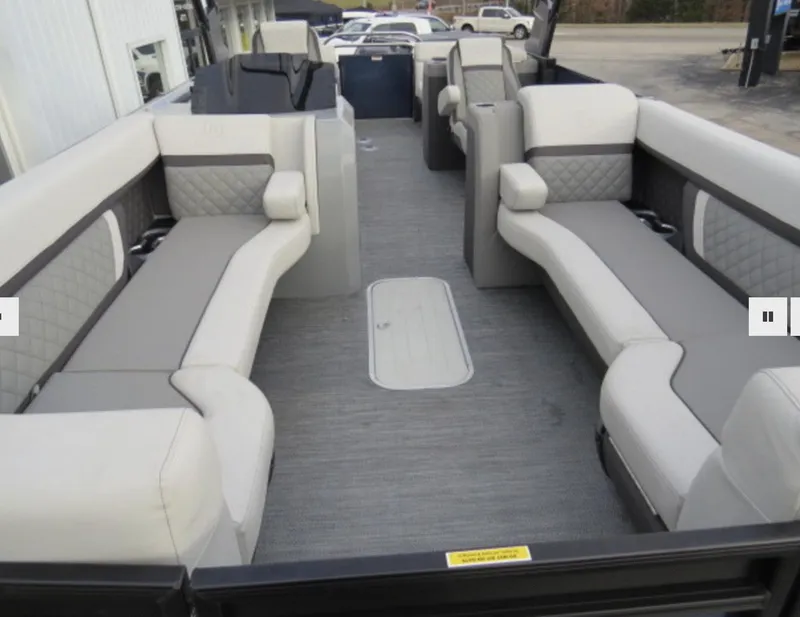 Slide: The Image of 2023 Godfrey AquaPatio 255 SBC pontoon boat interior with spacious seating. - 4