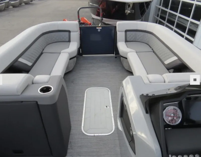 Slide: The Image of 2023 Godfrey AquaPatio 255 SBC boat interior with spacious seating and modern design. - 5