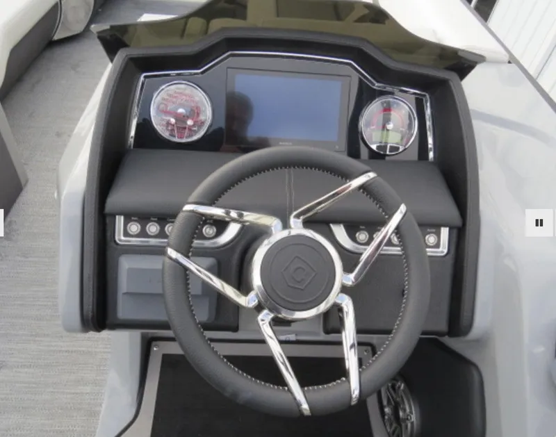 Slide: The Image of 2023 Godfrey AquaPatio 255 SBC dashboard with steering wheel and control panel. - 7