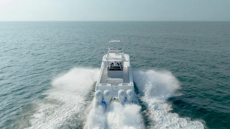 Slide: The Image of 2023 SeaHunter 46 CTS boat cruising on open ocean waters. - 11