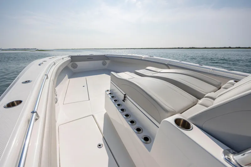 Slide: The Image of 2023 SeaHunter 46 CTS boat with spacious deck and luxurious seating on calm waters. - 16