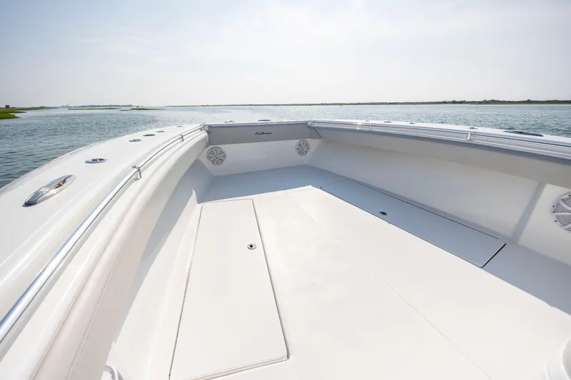 Slide: The Image of 2023 SeaHunter 46 CTS boat deck with spacious seating and ocean view. - 17