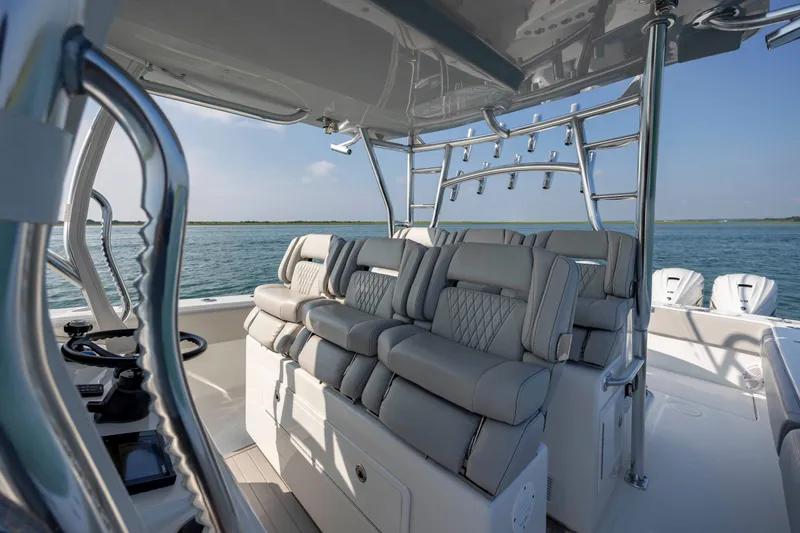 Slide: The Image of 2023 SeaHunter 46 CTS boat interior with luxurious seating and ocean view. - 23