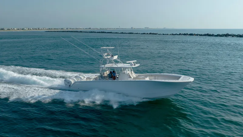 Slide: The Image of 2023 SeaHunter 46 CTS boat cruising on open water, showcasing speed and elegance. - 36