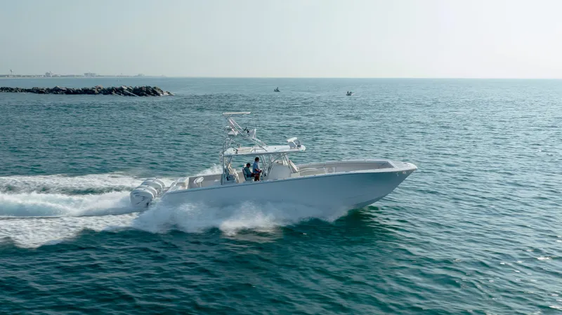 Slide: The Image of 2023 SeaHunter 46 CTS cruising on open water, showcasing sleek design and powerful performance. - 37
