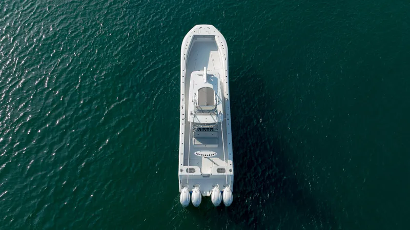 Slide: The Image of Aerial view of 2023 SeaHunter 46 CTS boat on open water. - 47