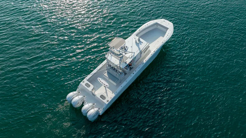 Slide: The Image of 2023 SeaHunter 46 CTS boat on open water, aerial view. - 48