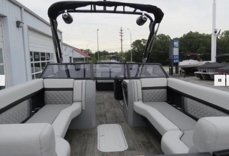 Slide: The Image of 2023 Godfrey AquaPatio 255 ULW pontoon boat interior with luxurious seating and modern design. - 11