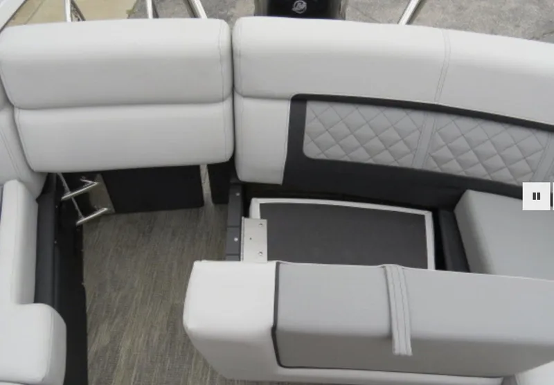 Slide: The Image of 2023 Godfrey AquaPatio 255 ULW boat interior with gray cushioned seating. - 9