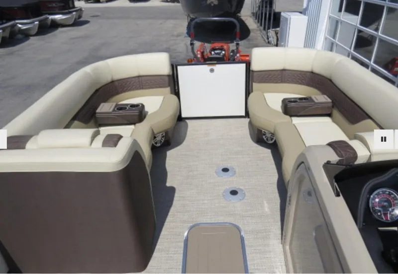Slide: The Image of 2023 Godfrey Monaco 235 SFL pontoon boat interior with beige and brown seating. - 13