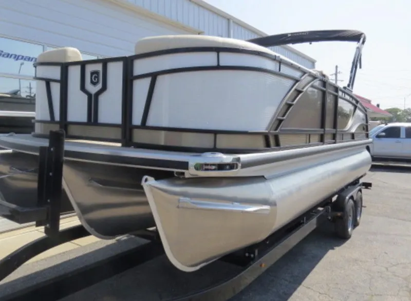 Slide: The Image of 2023 Godfrey Monaco 235 SFL pontoon boat on a trailer. - 2