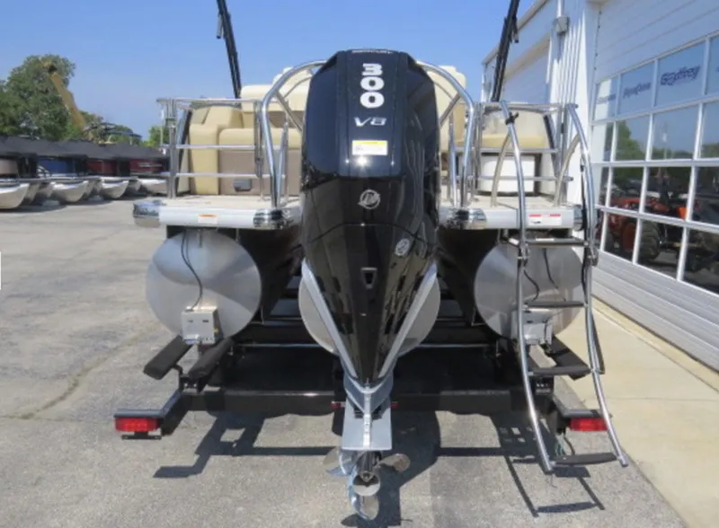 Slide: The Image of 2023 Godfrey Monaco 235 SFL pontoon boat with 300 V8 engine, rear view. - 3