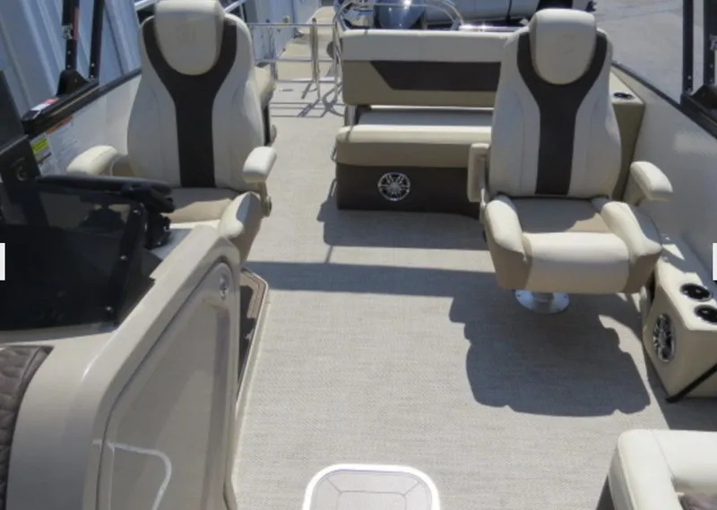 Slide: The Image of 2023 Godfrey Monaco 235 SFL interior with beige and brown seating. - 4