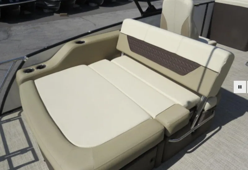 Slide: The Image of 2023 Godfrey Monaco 235 SFL boat with beige and brown cushioned seating. - 6
