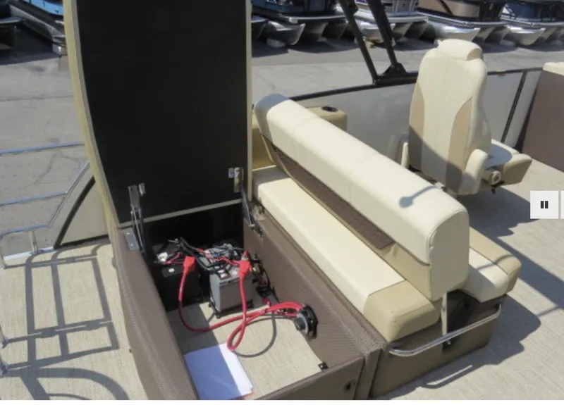 Slide: The Image of 2023 Godfrey Monaco 235 SFL boat interior with open storage compartment and seating. - 7