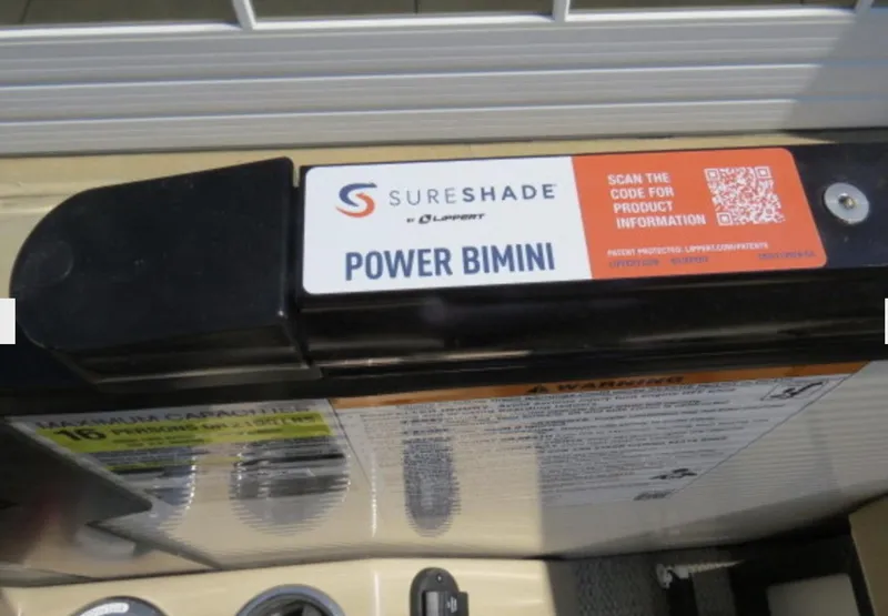 Slide: The Image of SureShade Power Bimini on 2023 Godfrey Monaco 235 SFL boat, with QR code for product info. - 9