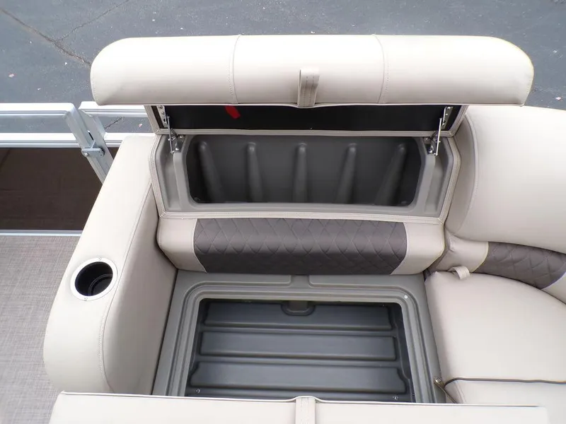 Slide: The Image of 2024 Sun Tracker SportFish™ 22 DLX boat storage compartment with cushioned seating. - 28
