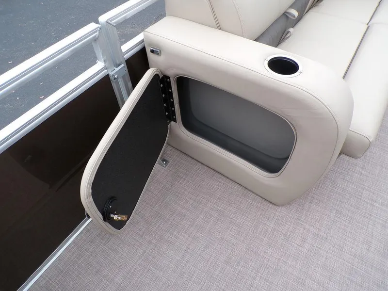 Slide: The Image of 2024 Sun Tracker SportFish™ 22 DLX boat interior storage compartment with beige seating. - 33