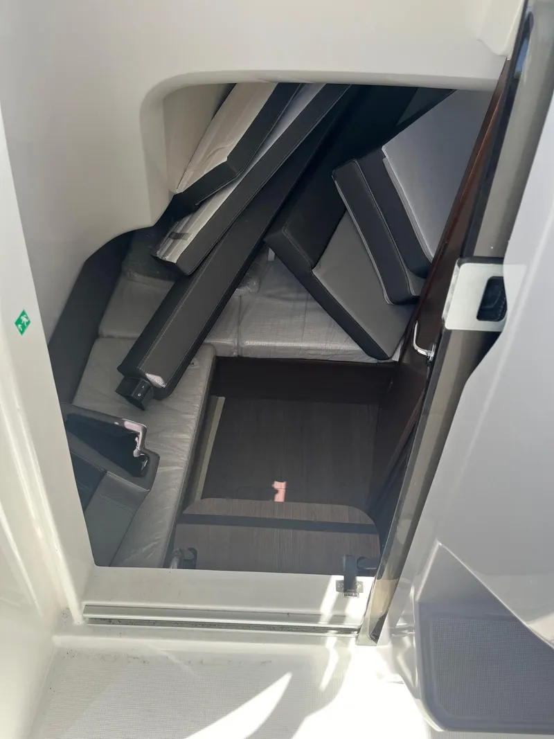 Slide: The Image of Interior cabin of 2024 Jeanneau Leader 9.0 CC with cushions and seating. - 12