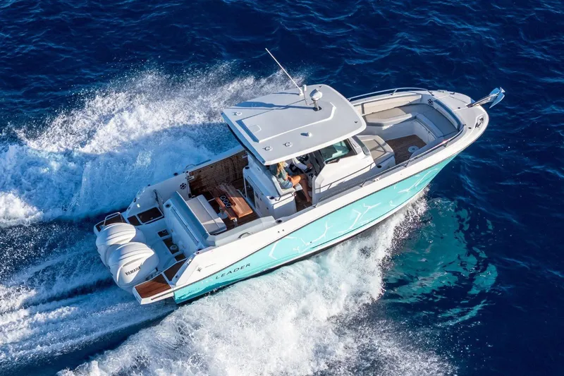 Slide: The Image of 2027 Jeanneau Leader 9.0 CC cruising on open blue waters. - 10