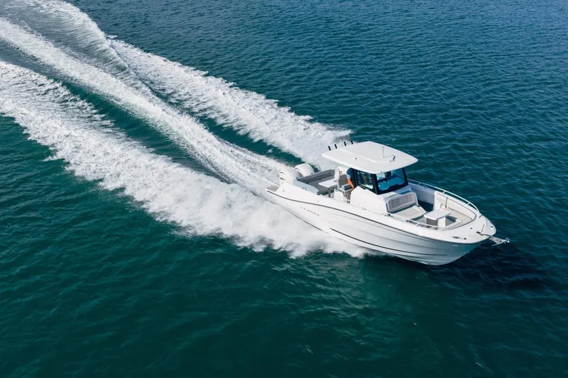 Slide: The Image of 2027 Jeanneau Leader 9.0 CC cruising on open water, showcasing sleek design and powerful performance. - 3