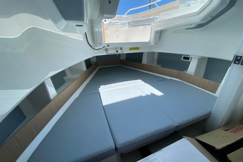 Slide: The Image of Interior cabin of 2027 Jeanneau Leader 9.0 CC boat with cushioned seating. - 37