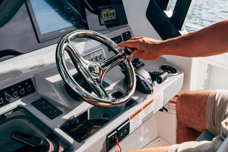 Slide: The Image of Steering console of 2027 Jeanneau Leader 9.0 CC boat with modern controls. - 6