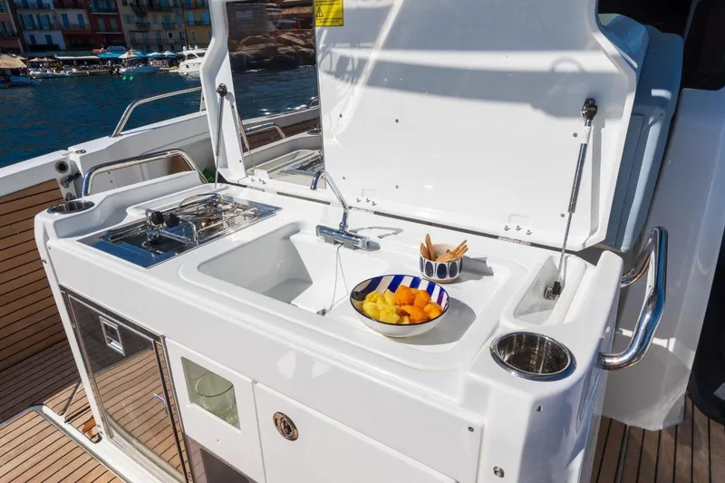 Slide: The Image of Outdoor kitchen on 2027 Jeanneau Leader 9.0 CC yacht with sink and fruit bowl. - 7