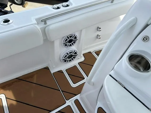 Slide: The Image of 2023 HCB 39 Speciale boat interior with speakers and teak flooring. - 11